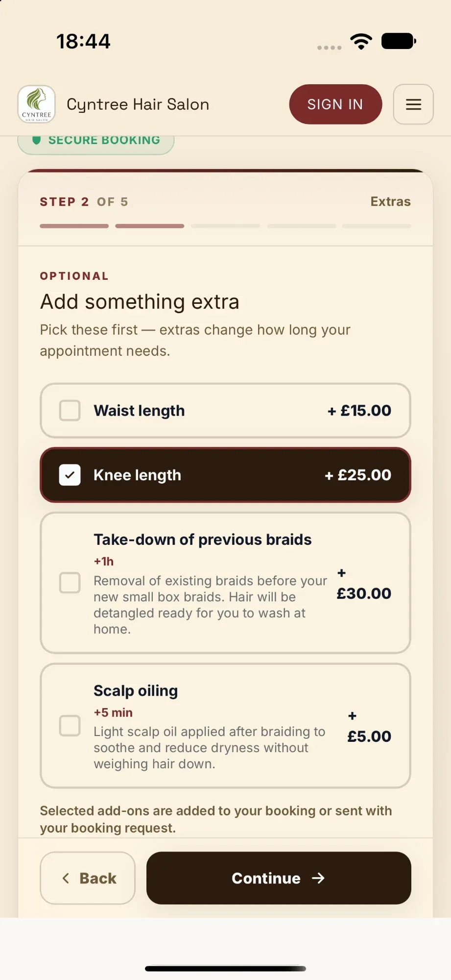 Booking page extras step with Knee length selected for £25.00, alongside Waist length, take-down of previous braids and scalp oiling.