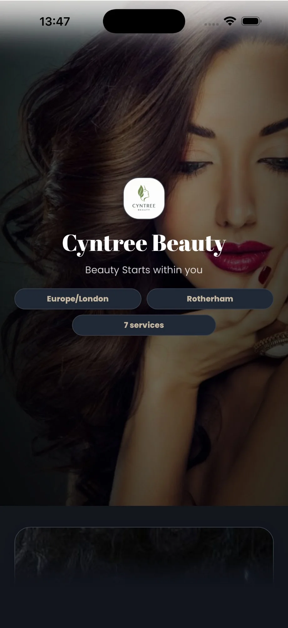 The free Cyntree booking site in its dark palette: logo, business name, tagline and location over a portrait photo.